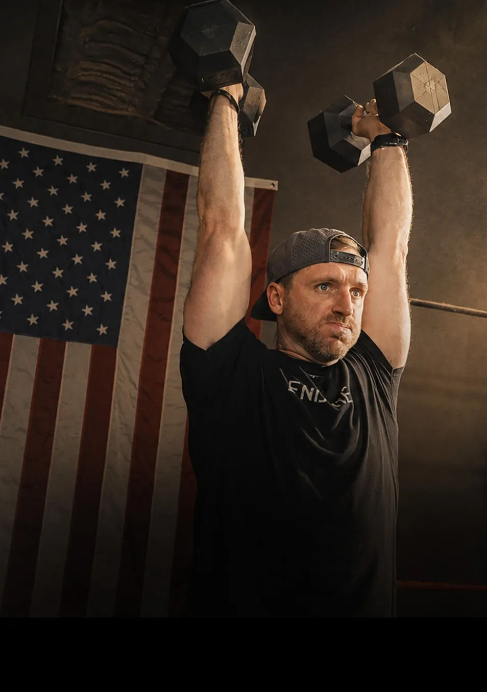 Athlete pressing dumbbells